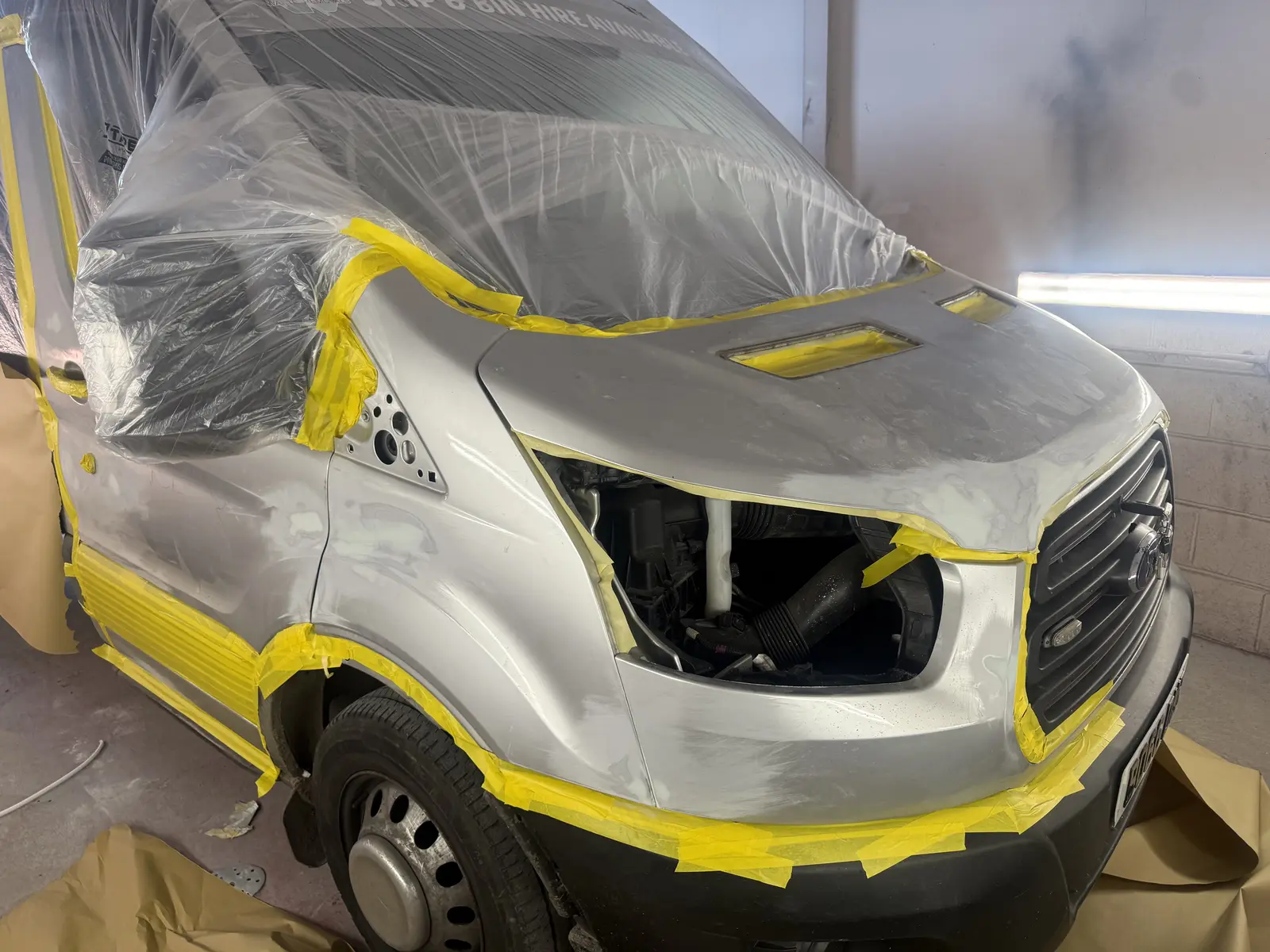 Ford Transit front panels prepared and masked for refinishing