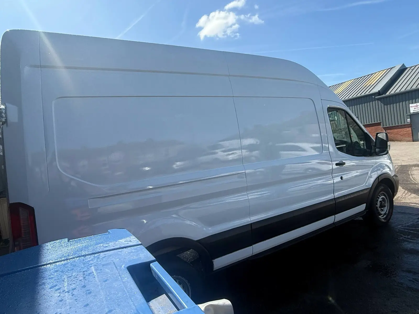 White Ford Transit side view after commercial vehicle repaint